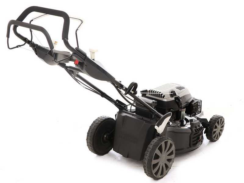 Self propelled mower with bagger top