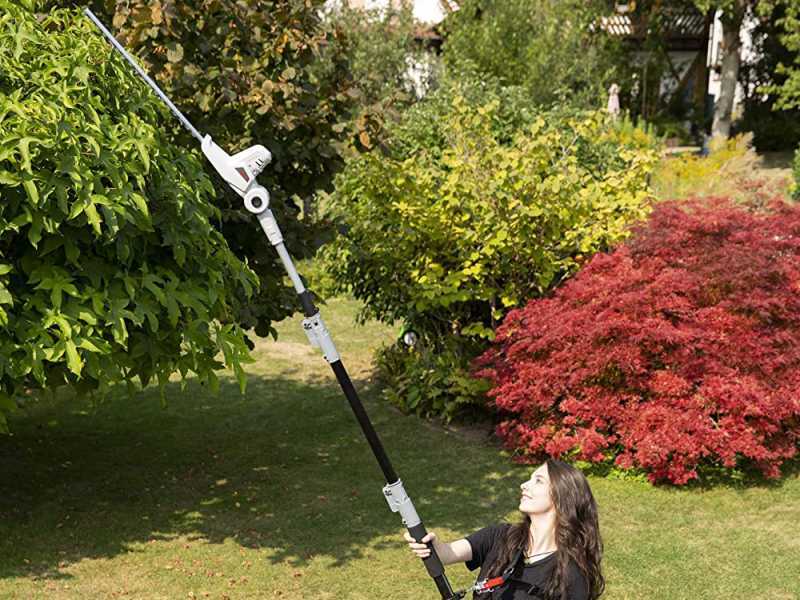 Battery powered outlet telescopic hedge trimmer