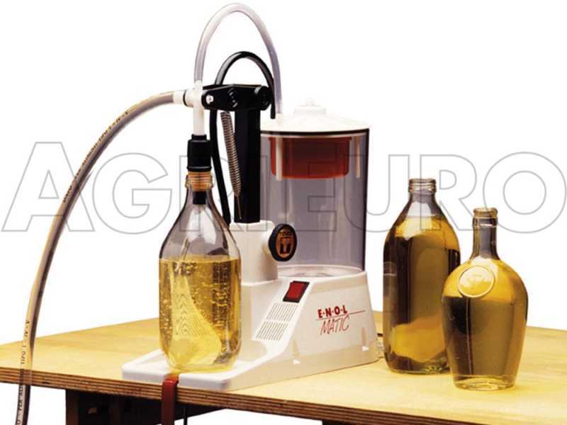 Enolmatic counter top electric filling machine for spirits, grappa and amaro (bitter) liqueurs