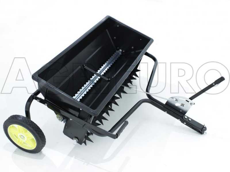 Lawn aerator outlet seeder