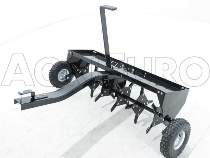 Towed online lawn scarifier